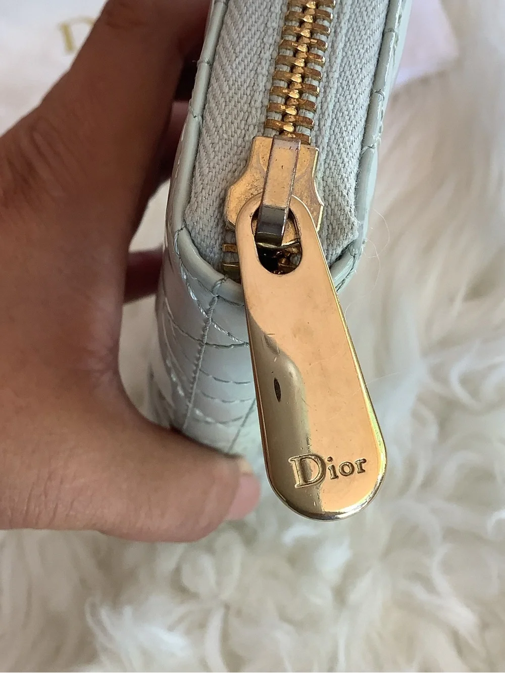 Christian Dior Voyageur wallet made of sage green patent leather